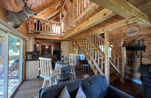 Hannibal Apartment | Relax at The Lincoln Log Cabin perched along the Jump River.