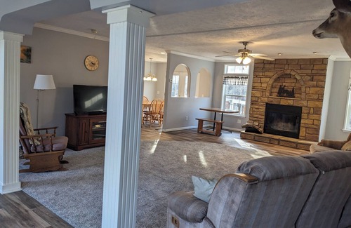 Bluford House | Relax at Woodland Country Lodging, surrounded by the beauty of nature.