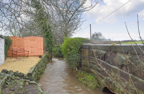 Knott End-on-Sea Cottage | Relax by the stream in the garden or visit the historic city of Lancaster.