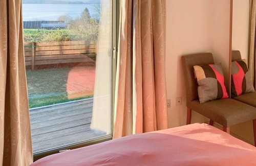 Breakish Cottage | Relax by the wood burner and look out across the sound of Sleat and beyond planning the next day’s a