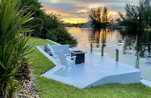 Burnt Store House | Relax! Canal Home, Sunsets, Heated Pool, Lanai with TV, Boat Dock, Gulf Access
