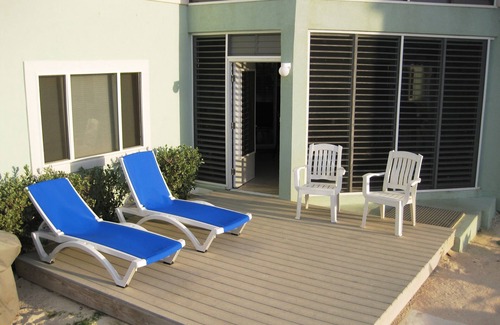 North Side Condo | Relax in Cayman Casual style. Modern convenience in a quiet beachfront setting.