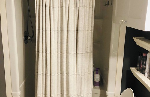 Saint Thomas House | Relax in our cozy room with a private bath, designed for comfort and privacy.