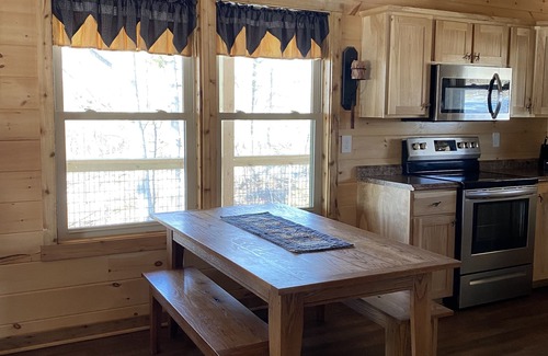 Stanley Cabin | Relax in our secluded hot tub overlooking the pond with a glass of wine