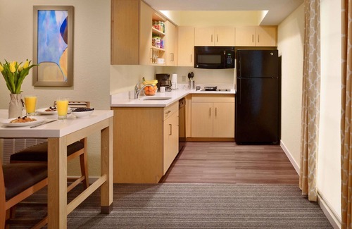 Somerset Hotel | Relax in Spacious Suite with Full Kitchen and Seasonal Swimming Pool