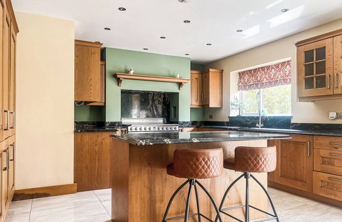 Margam Cottage | Relax in the hot tub and unwind in the peaceful, private garden.