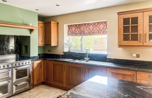 Margam Cottage | Relax in the hot tub and unwind in the peaceful, private garden.