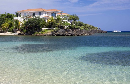 Half Moon Bay Villa | Relax into luxury at our West End beachfront villa—with private pool