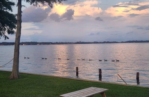 Durants Neck Cottage | Relax on the Little River with a pool, fishing, and river access.