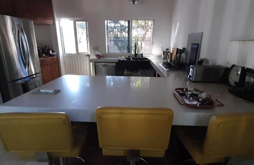 Compostela House | relax poolside or take a casual stroll 600m to the beach.