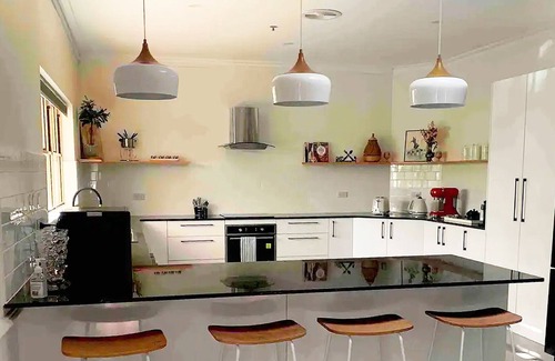 Carbrook House | Relax with your whole family at this serene resort-style retreat.