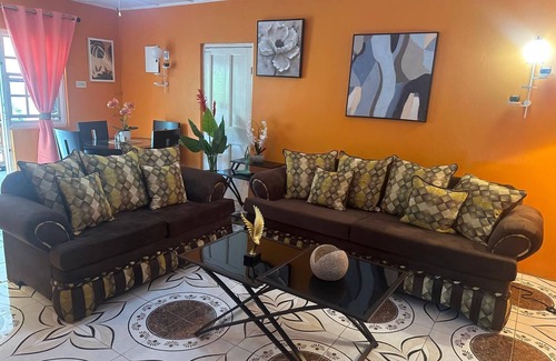 Stewart Town House | Relaxed Comfort in the Heart of Brown’s Town in a lovely 3-bdrm bungalow w/WiFi