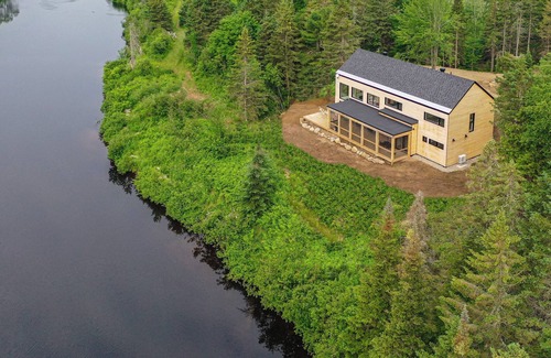 Mauricie House | Relaxing Escape w/Fireplace, BBQ & Serene Du Loup River Backdrop