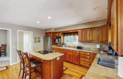 Huddleston House | Relaxing lakefront escape with hot tub, dog-friendly fenced yard, dock & kayaks