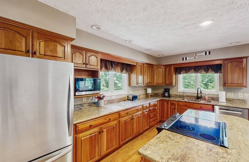 Huddleston House | Relaxing lakefront escape with hot tub, dog-friendly fenced yard, dock & kayaks