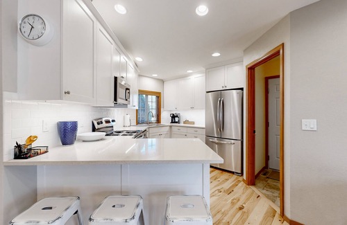 Southeast Boise House | Relaxing retreat with a gas fireplace, fenced yard, patio, & washer/dryer