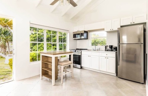 Bottle Creek Apartment | Relaxing Stay: Kitchen, Balcony & Beach Steps Away