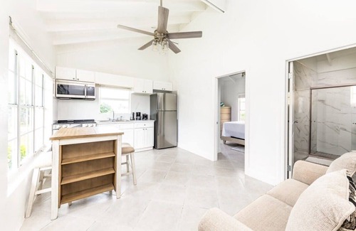 Bottle Creek Apartment | Relaxing Stay: Kitchen, Balcony & Beach Steps Away