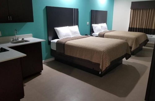 Bay City Hotel | Relaxing Two Queen Bedroom and Kitchenette in Quiet Bay City Location, 2 Units