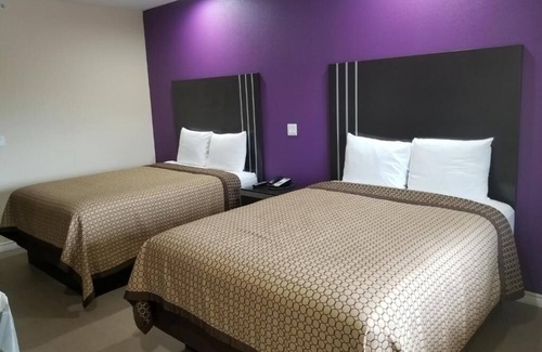 Bay City Hotel | Relaxing Two Queen Bedroom and Kitchenette in Quiet Bay City Location, 2 Units