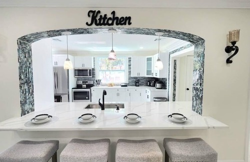 Royal Palm Beach House | Remodeled cozy family house with heated pool, 10 min from the airport!