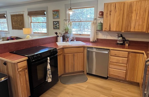 Central Lake House | Remodeled Gem. Kayaks + Lake Access. Under 8 miles to Torch Lake boat launch.