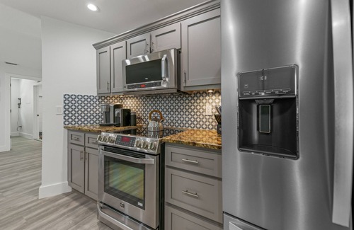 Bay Isle House | REMODELED, Heated Pool and Spa, POOL Table, games, bikes included!