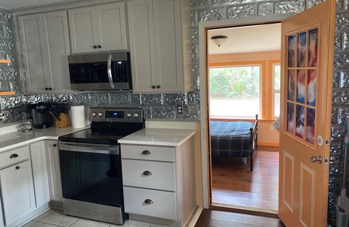 Carrabelle Cottage | Remodeled historic cottage with a peek of the Gulf of Mexico.