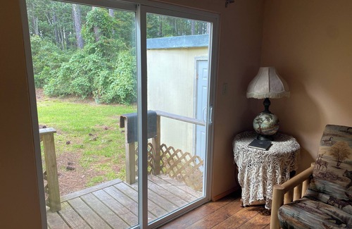 Carrabelle Cottage | Remodeled historic cottage with a peek of the Gulf of Mexico.