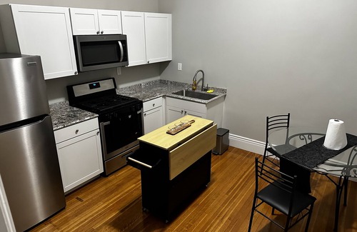 Oswego Apartment | Remodeled Historical Mansion Minutes from Oswego’s Best!