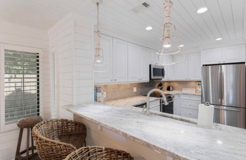 Gulf Pines House | Remodeled Villa with private deck on Horseshoe Lake, minutes to beach