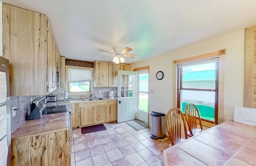 Onekama House | Remodeled, waterfront home on Portage Lake with dock & firepit - 2 dogs OK