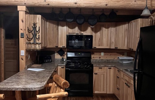 Champion Cabin | Remote log lodge in the Huron Mountain foothills.