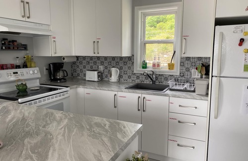 Halifax County House | Renovated 150 year old house, snuggled in the cove with ocean views