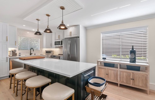 Royal Harbor Condo | RENOVATED 2 Bed, 2 Bath 1st floor with heated pool on the bay!