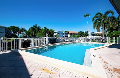 Royal Harbor Condo | RENOVATED 2 Bed, 2 Bath 1st floor with heated pool on the bay!