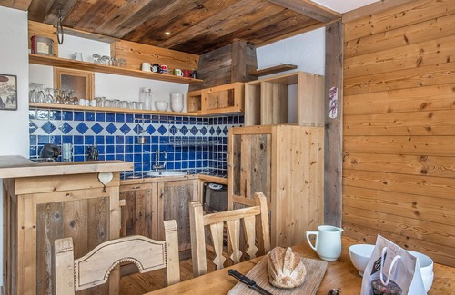 Courchevel Apartment | Renovated apartment with open kitchen, balcony, and direct slope access