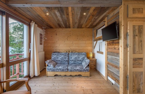 Courchevel Apartment | Renovated apartment with open kitchen, balcony, and direct slope access