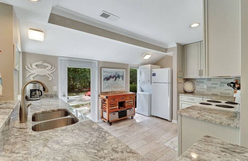 Lawton Woods House | Renovated coastal Sea Pines beach home with a private pool