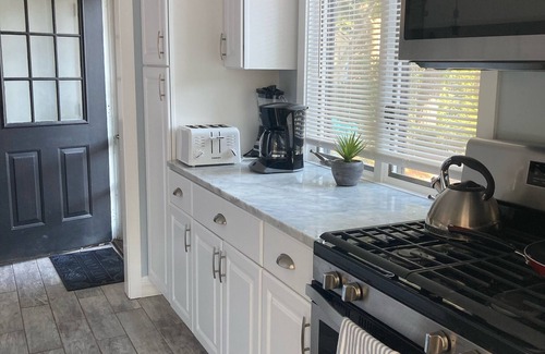 Mews Village House | Renovated Home with heated pool near the beach! Fenced in yard +pet friendly