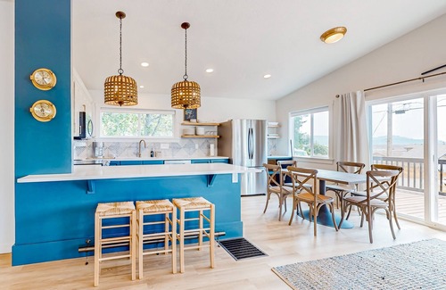 Bay City House | Renovated home with wood stove, water views, & expansive balcony - dog ok