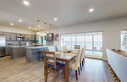 Lake Placid House | Renovated lakefront retreat with screened pool, private dock, patio, grill & W/D