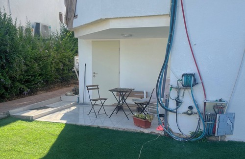 Qiryat Shemona Apartment | Renovated one room unit with a bomb shelter and a garden.