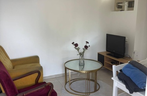 Qiryat Shemona Apartment | Renovated one room unit with a bomb shelter and a garden.