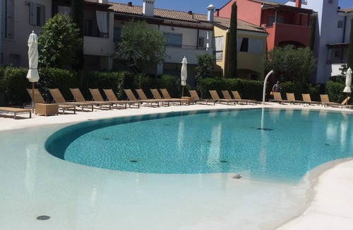 Jesolo Apartment | Residence apartment with swimming pool, first floor with terrace