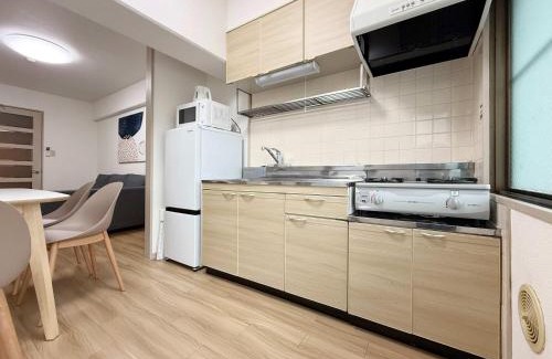 Hiroshima City Centre Apartment | Residence Yu - Relaxing 2BR Near City Center Dining & Kitchen