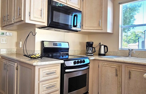 Braden River House | Resort Living at SUN OUTDOORS —Steps to Pool + Golf Cart Included! n