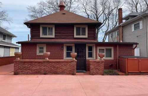 Luna Pier House | Restored historic log cabin & deck on Lake Erie