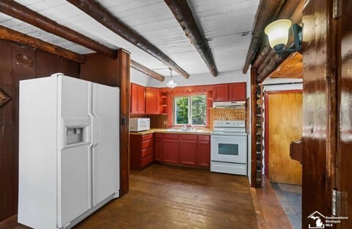 Ida Cabin | Restored historic log cabin and deck on Lake Erie