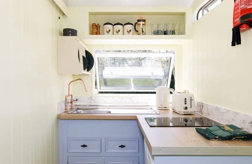 Birdham House | Restored Showman's Carriage with King Bed